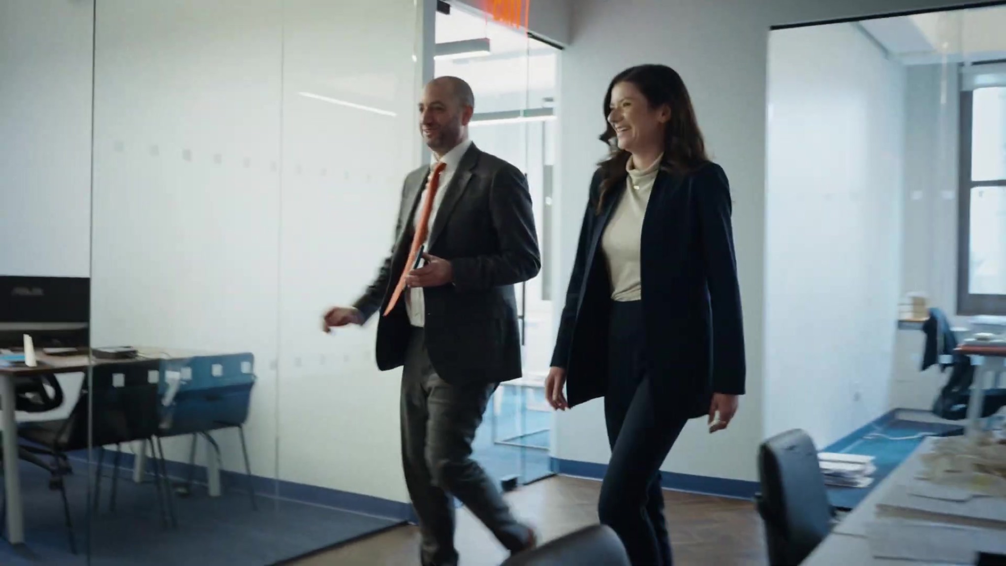 Colleagues walking through the Spodek Law Group office