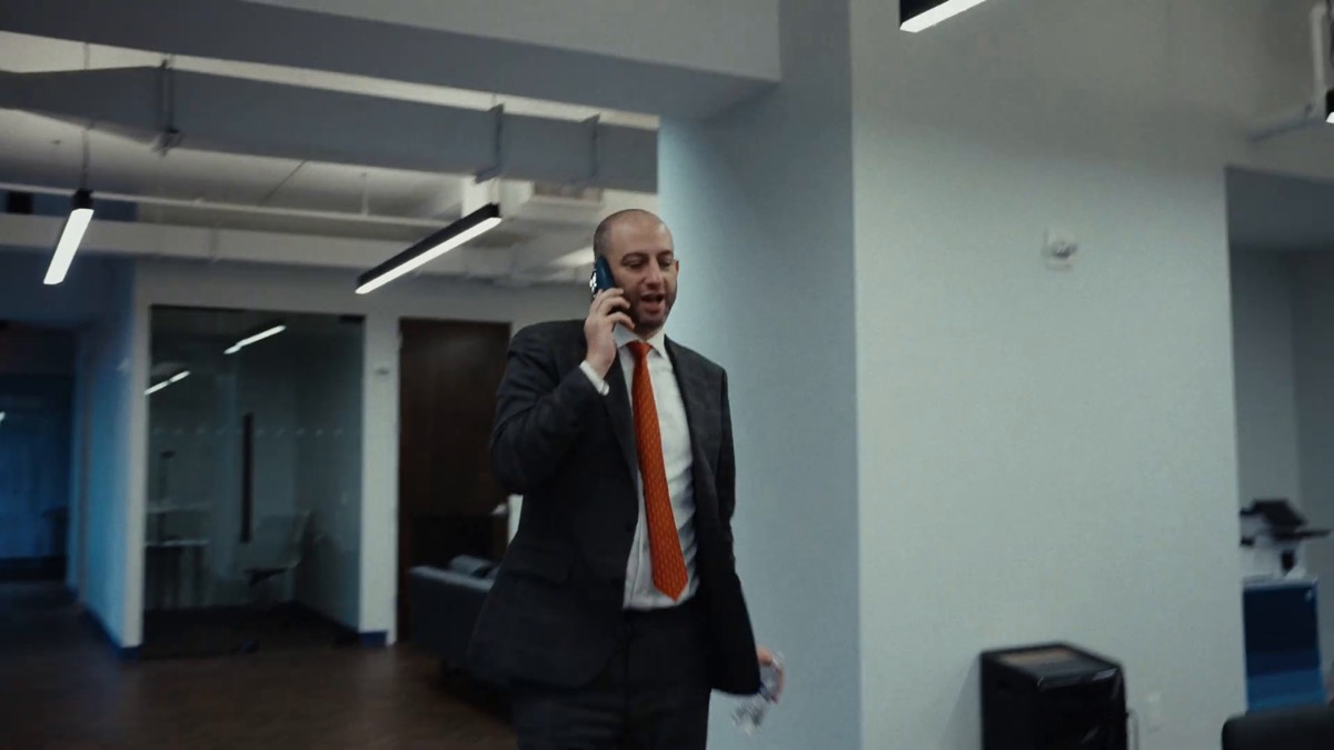 NYC criminal lawyers at Spodek Law Group consulting with a client by phone